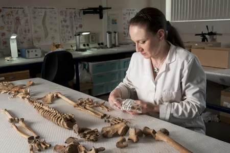 Dr. Anwen Caffell lays out the remains of a Scottish soldier found in a mass grave in Durham, England.
