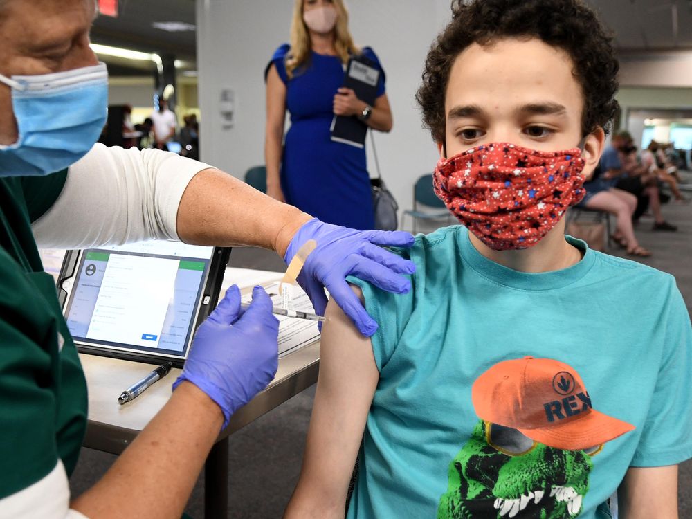 A nurse gives a 16-year-old a shot of the vaccine at a clinic in Florida.