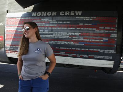 “Loving old airplanes, I tend to go up to people and ask them if I can help with theirs,” says Rohaise Firth-Butterfield, standing beneath the wing of the Collings Foundation B-24 during its visit to the San Antonio airport.