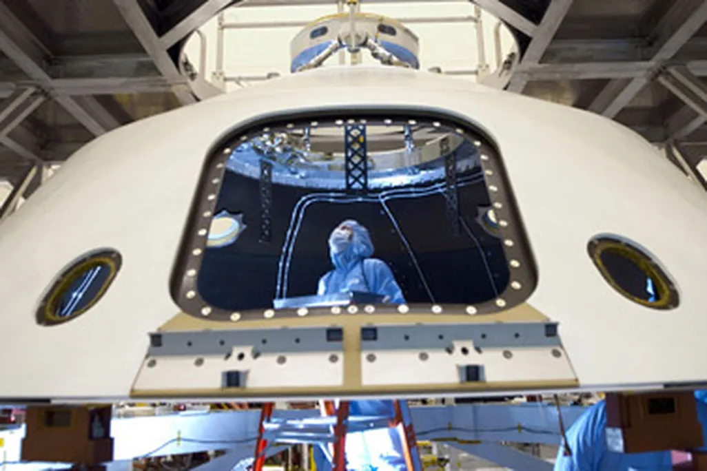 Technicans work on the Mars Science Laboratory, aka Curiosity
