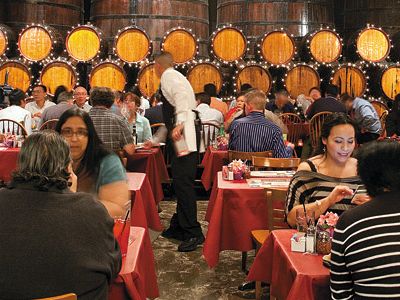 Century-old casks line the winery’s restaurant, built inside its 1940s redwood wine tank room.