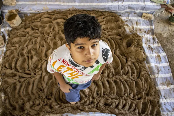 Child trampling clay thumbnail