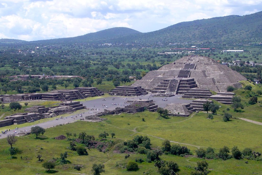 Overhead view of the Pyramid of the Moon in a green landscape