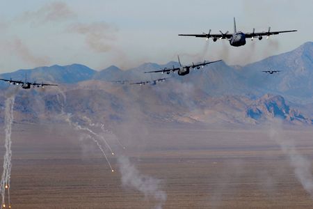 U.S. Air Force C-130 Hercules aircraft fire chaff and flare countermeasures over the Nevada Test and Training Range Nov. 17, 2010.