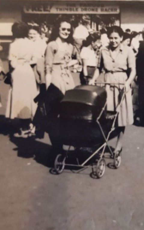 Joyce Espe pushes her son, Victor, in a stroller.
