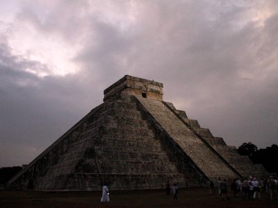 In this Dec. 21, 2012 file photo, people gather in front of the Kukulkan temple in Chichen Itza, Mexico. Mexican experts said Wednesday, Nov. 16, 2016 they have discovered what may be the original structure at the pyramid of Kukulkan at the Mayan ruins of Chichen Itza.