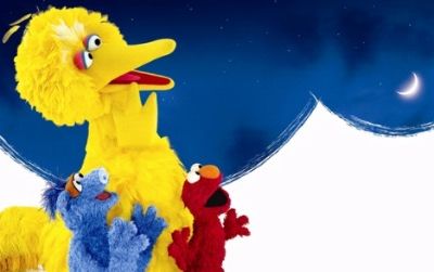 Big Bird and the gang star in "One World, One Sky" at the planetarium