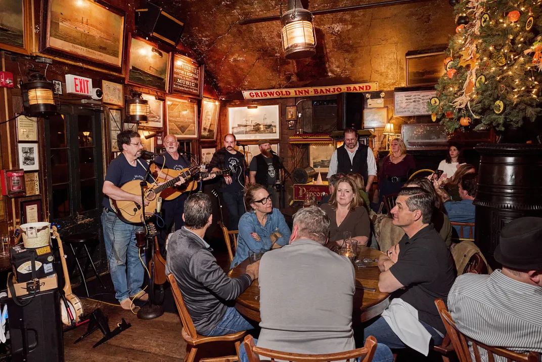 Each Monday at the Griswold Inn in Connecticut, the Jovial Crew (above left) performs maritime songs. In one of the dining rooms,