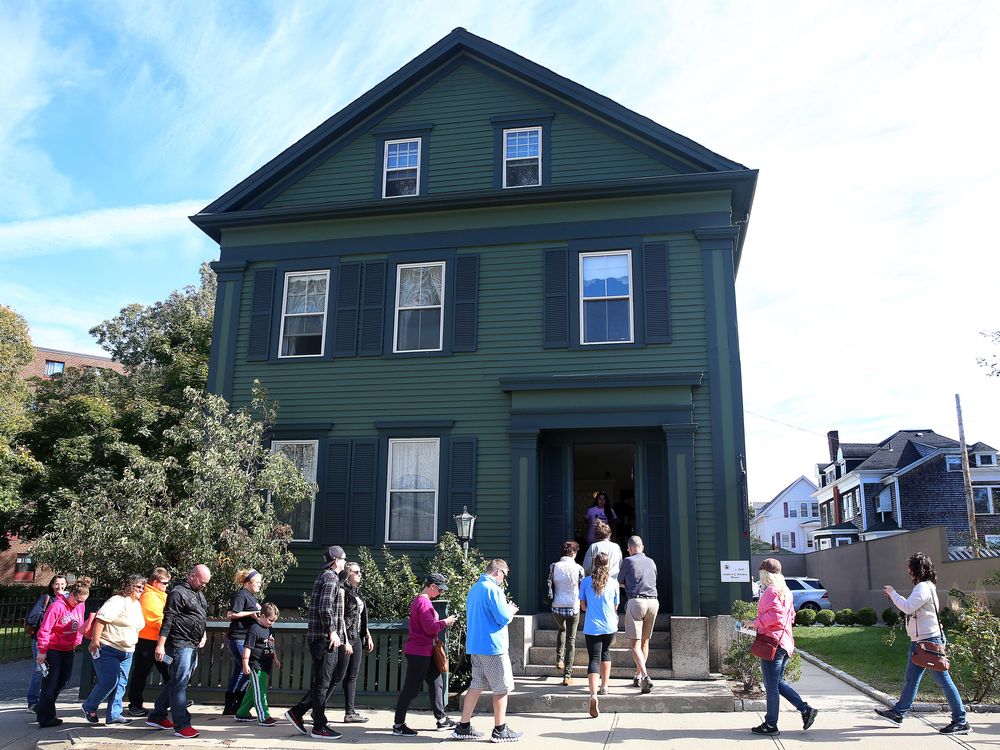 Tourists walk into the Lizzie Borden House