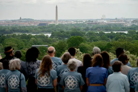 Descendants of Confederate General Robert E. Lee and descendants of slaves owned by Lee face Washington, DC, as they pose for a photo during a reunion at Lee's former plantation home, the Arlington House, at Arlington National Cemetery in Arlington, Virginia, on April 22, 2023.