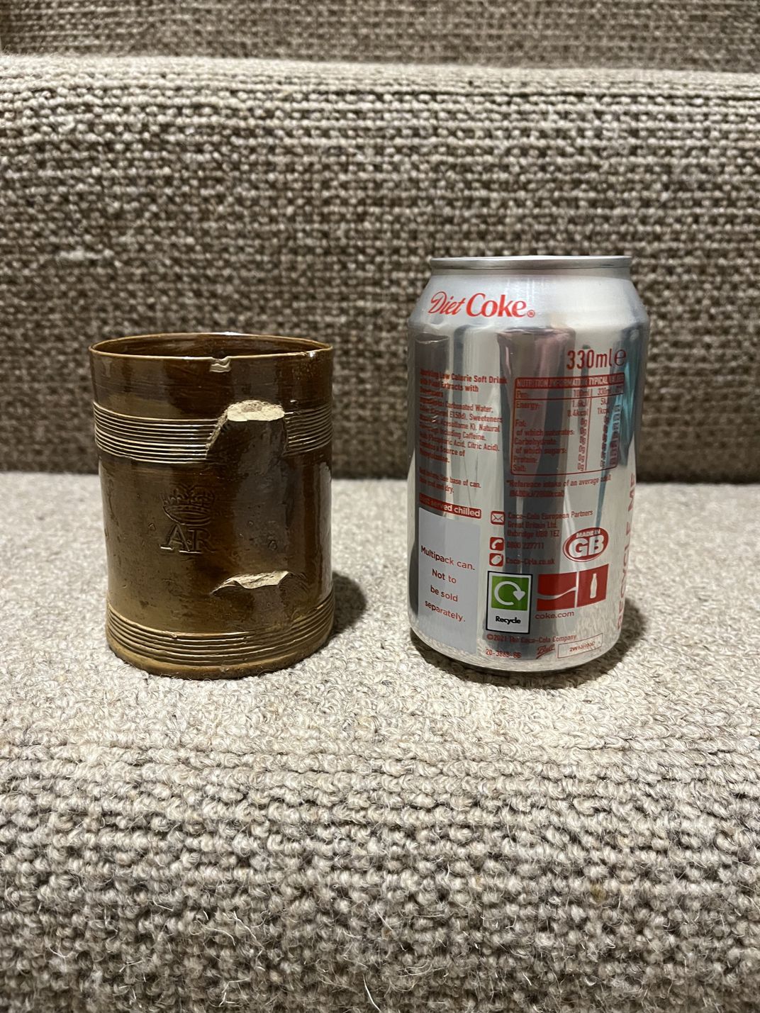 Stoneware and soda can