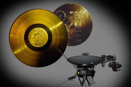 The Golden Record, shown here with its cover that has instructions on how to play it (upper right), was carried on Voyager in the section indicated with the yellow circle on this artist's impression. 