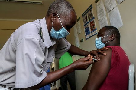 A man receives a Covid-19 vaccine in Zimbabwe.