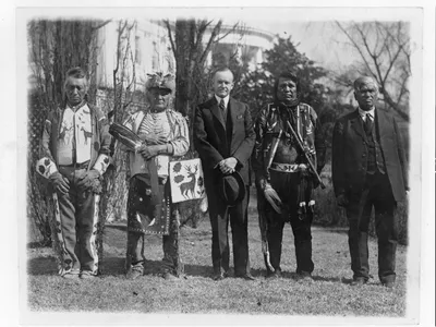 Calvin Coolidge poses with Native American leaders on the White House lawn in 1925.