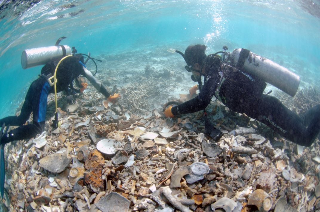 Divers excavate the Huaguangjiao One wreck.