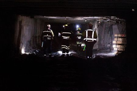 Coal miners walk through a tunnel at the Consol Energy Bailey Mine in Wind Ridge, Pennsylvania in 2013.