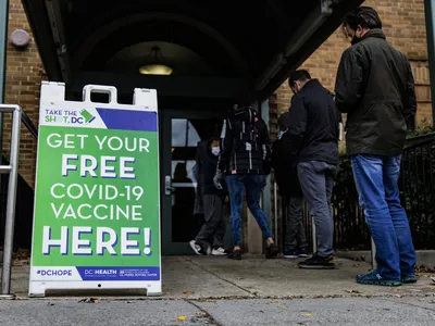 People line up for Covid-19 vaccines in Washington, D.C., last December. The Food and Drug Administration approved updated booster shots Wednesday.&nbsp;