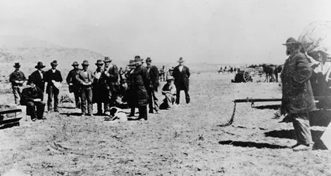 John D. Lee, seated on his coffin, moments before his execution.