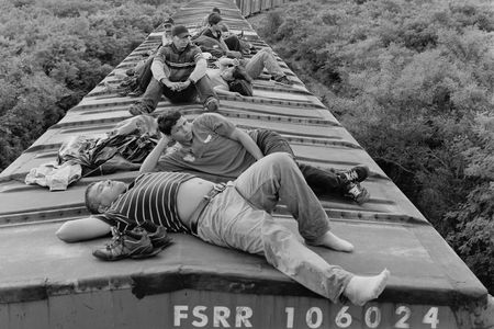 Central American migrants ride a northbound cargo train through the southern Mexican state of Oaxaca. July 2010.