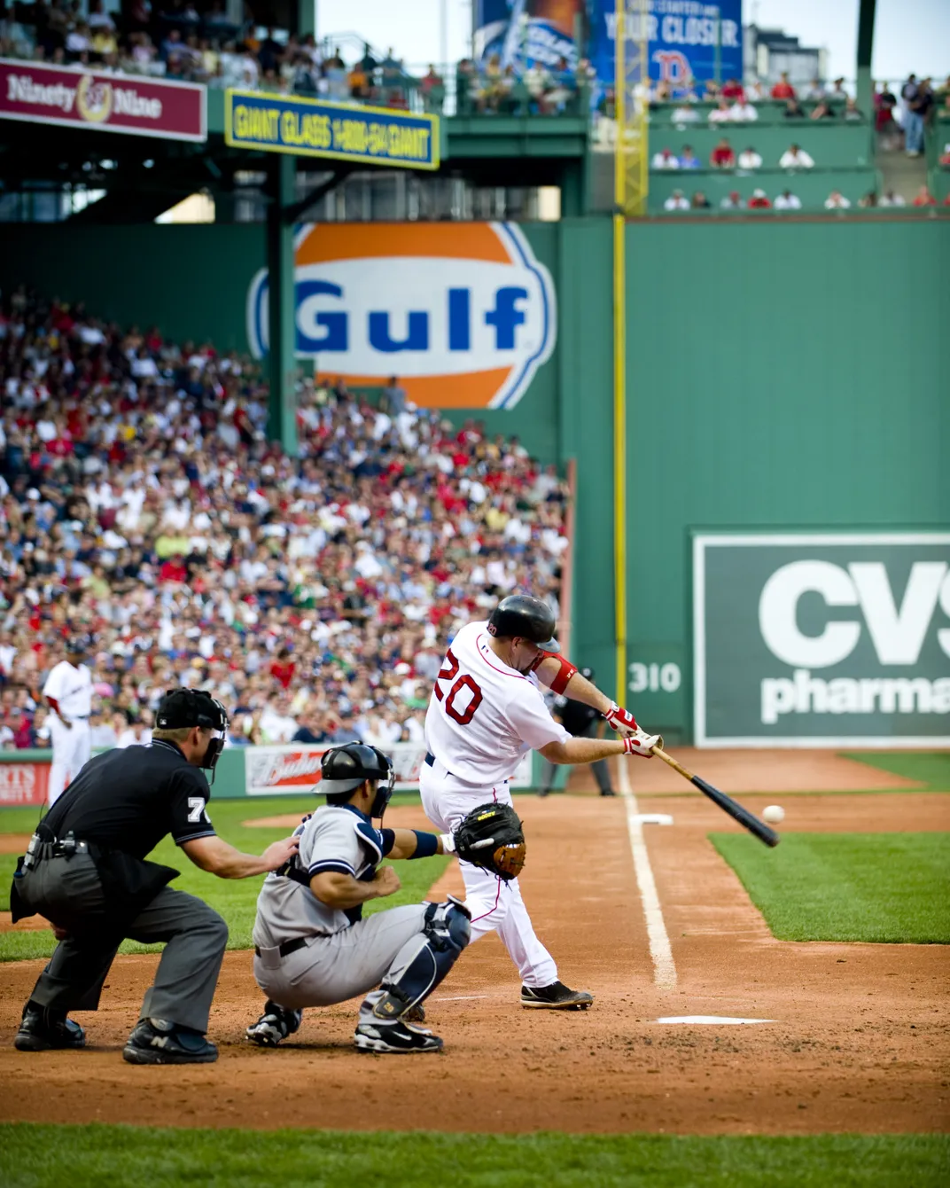 a baseball player takes a swing