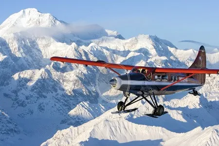 With Mount Hunter looming over his right wing, Paul Roderick, director of flight operations for Talkeetna Air Taxi, flies over his favorite place to ski.