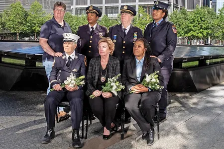 Women who responded to the call of duty on 9/11, shown at the Ground Zero Memorial in Lower Manhattan. Back row: EMT Bonnie Giebfried, NYPD Chief of Transportation Kim Royster, NYPD Chief of Interagency Operations Theresa Tobin, Firefighter Regina Wilson. Front row (all now retired): FDNY Captain Brenda Berkman, Detective Sergeant Sue Keane, Assistant Port Authority Police Chief Norma Hardy. 