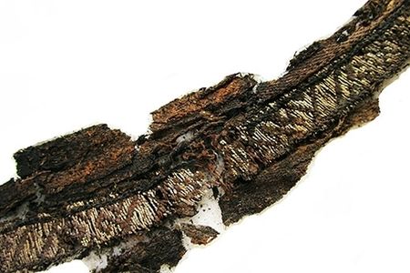 A Viking-age woven band of silk displays patterns in silver thread discovered to be Arabic script