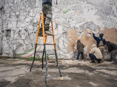 Blu and local activists erased 20 years' worth of his street art from Bologna, Italy. 