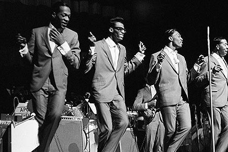 Famous for Motown hits like “My Girl” and “Get Ready,” the Temptations spin and glide through their polished choreography at the Apollo Theater.
