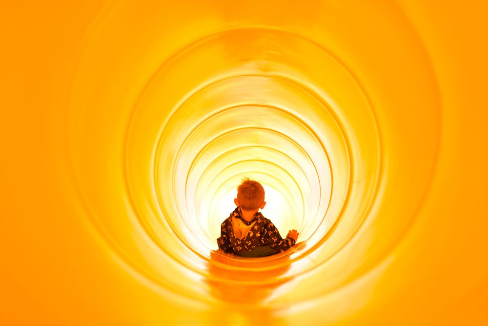 My little nephew going down a slide at a Dutch beach during a family vacation. I find this shot very symbolic of how he slides towards his future, unencumbered by age, responsibilities and all that many worries.
