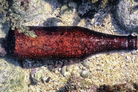 Trash, such as this glass bottle, has been found deep in the ocean, far away from shore.