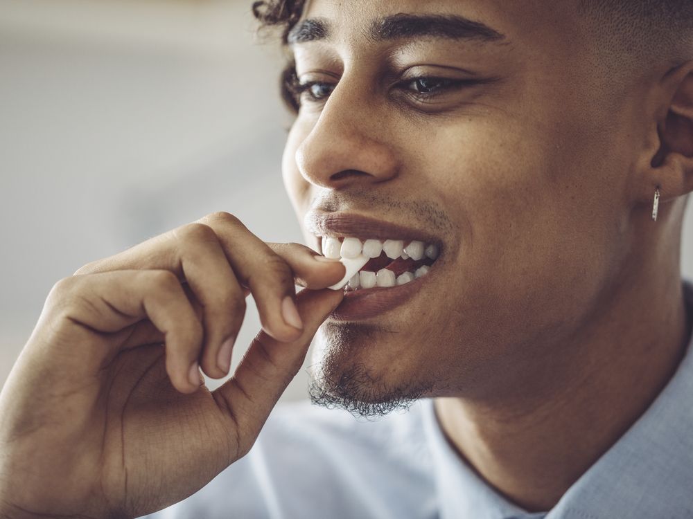 A man chews gum