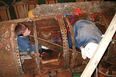 Conservators working on the H.L. Hunley