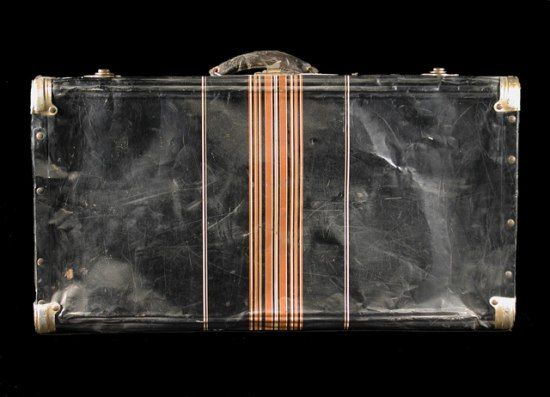 This black metal suitcase belonged to Iku Tsuchiya. It went with her to Tanforan Assembly Center, then to the Topaz camp, and back home to San Leandro, California. (NMAH)