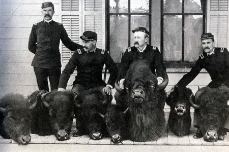 Soldiers pose with bison heads captured from poacher Ed Howell. In the early days of Yellowstone, poaching, setting the park on fire and defacing its hot springs were rampant.