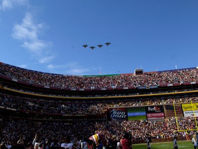 F-22 Raptors from the 1st Fighter Wing at Langley Air Force Base, Virginia, fly over a Washington Redskins vs. Dallas Cowboys football game in 2006.