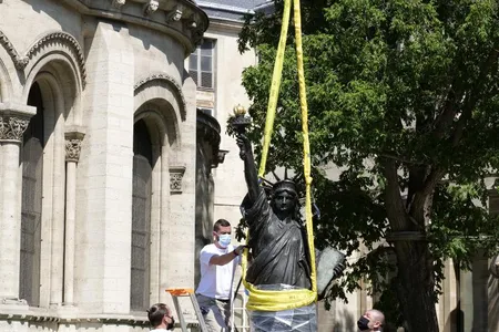 Workers removed the replica Lady Liberty from its plinth on June 7. The statue will set sail for the U.S. on June 19.