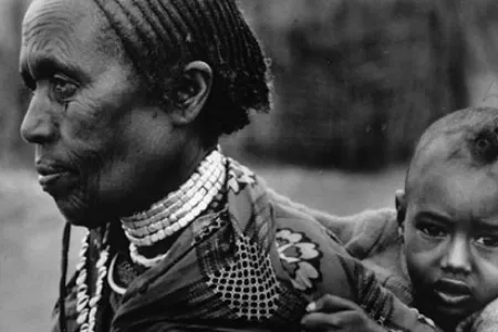 A grandmother in Ethiopia carries her grandchild.