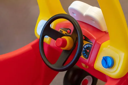 The little red car with the yellow roof that is propelled by foot power has been a hit with young children since its creation in 1979.