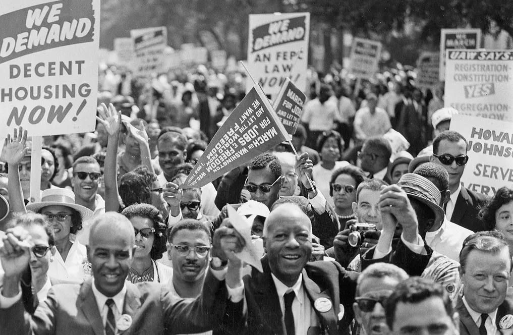 Civil rights leaders stand with protesters at the 1963 March on Washington