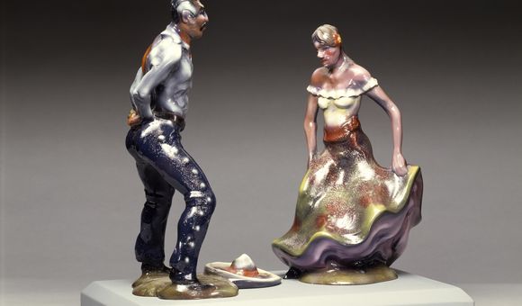 Fiberglass sculpture of a man and a woman at a fiesta.