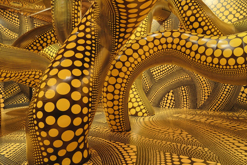 Worm-shaped figures covered in yellow polka dots