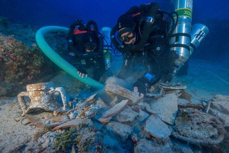 Divers examine ceramic artifacts that may hold clues about ancient medicines, perfumes and food.