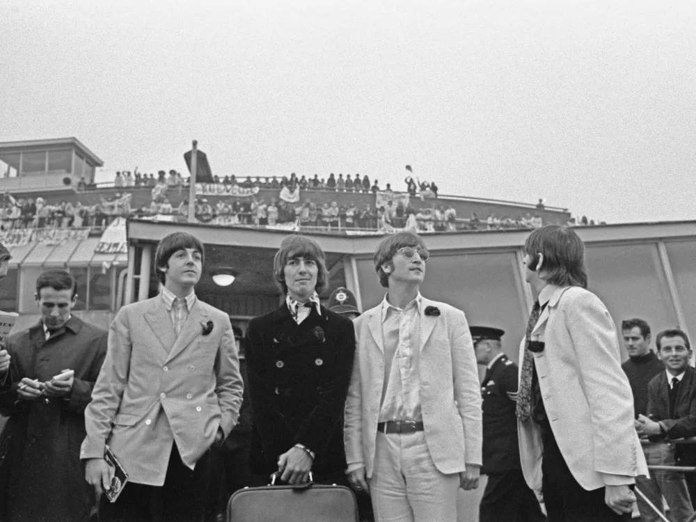 The Beatles arrive back at London Airport after their final concert tour of the United States.