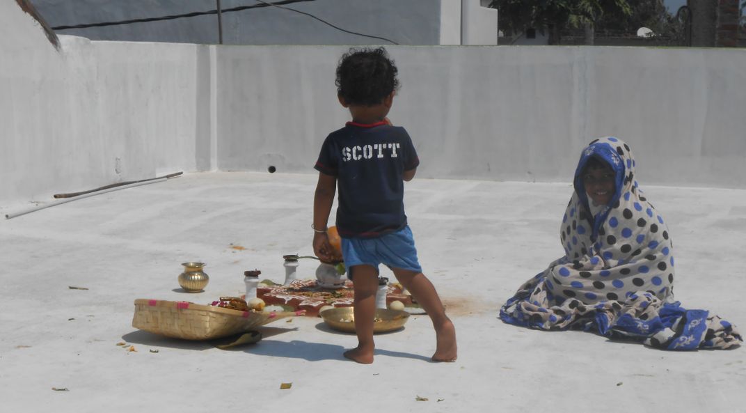 Children are protecting ritual things from birds in summer ...