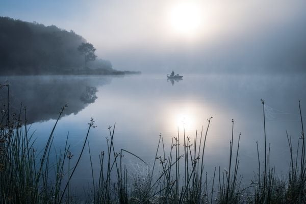 A fisherman on a foggy lake thumbnail