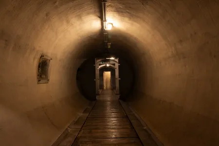 Located nearly 20 feet underground, this unfinished bunker is protected by 13-foot-thick concrete walls.

