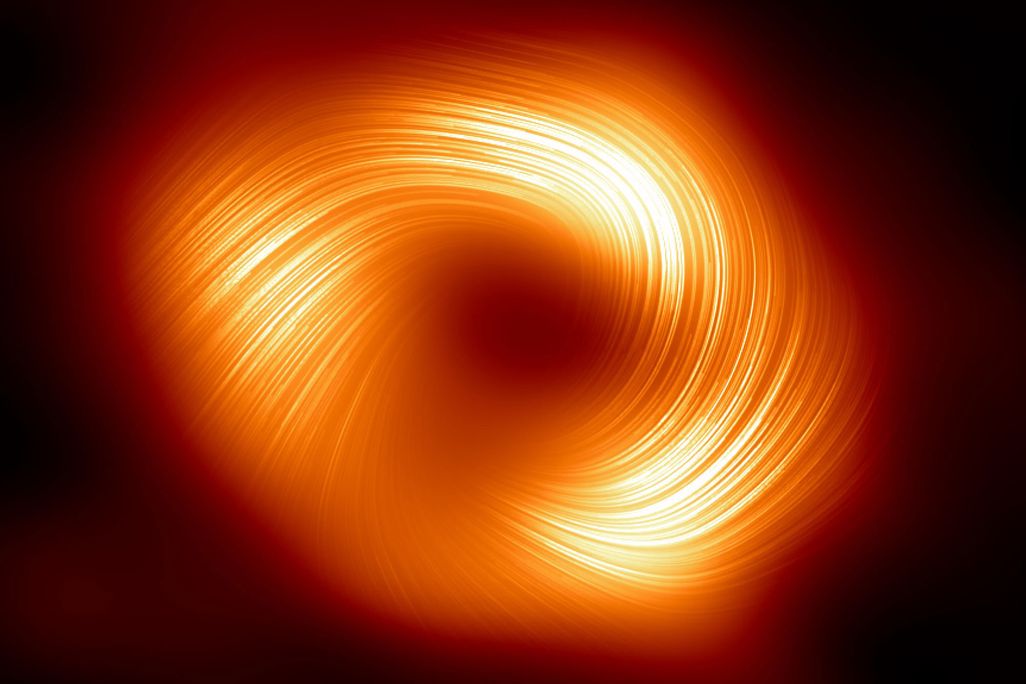 Orange light indicating magnetic fields spirals around the dark center of a black hole