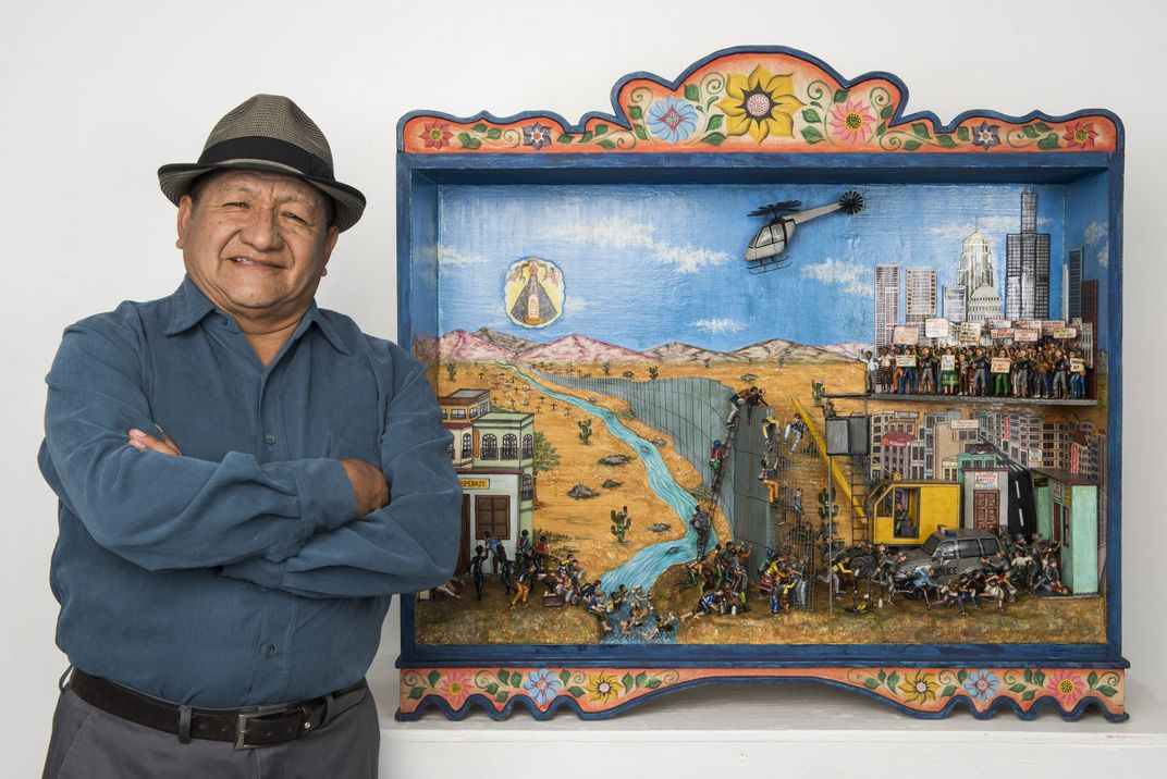 Nicario Jiménez Quispe with a retablo