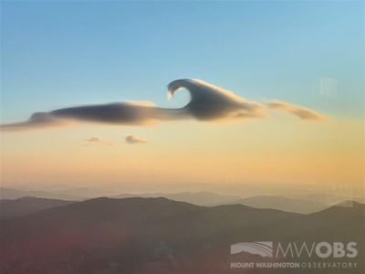 Not one, but two rare cloud features hovered side by side, lit by the sunrise, on Monday morning over Mount Washington in New Hampshire.